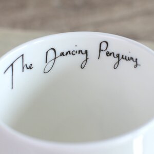 The Dancing Penguins Mug by Anna Wright